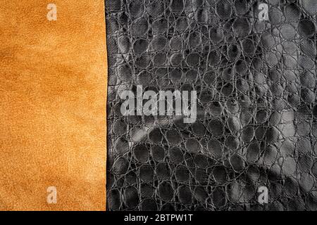 Brown leather and black artificial alligator skin textures background. Stock Photo