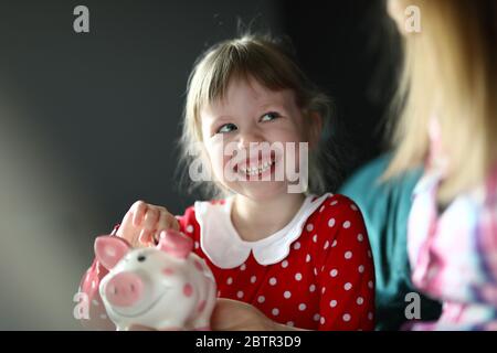 Cheerful toddler in red dress Stock Photo
