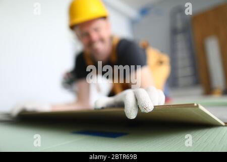 Happy foreman in apartment Stock Photo
