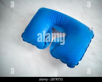 Blue inflatable pillow for comfortable neck position Stock Photo