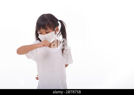asia girl wearing mask to prevent the virus PM2.5, Coronavirus, (2019-nCoV) asian little girl feeling unwell and coughing as symptom for cold or pneum Stock Photo