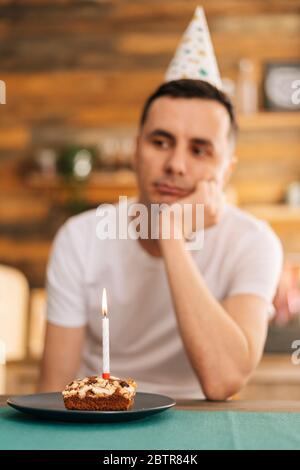 Young man celebrating birthday alone at home Stock Photo - Alamy