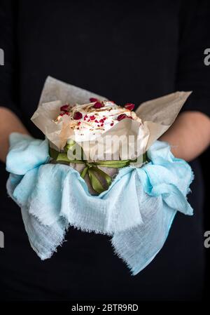 Easter composition with sweet bread, kulich and eggs on light background. Easter holidays breakfast concept. Stock Photo