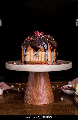 Easter composition with sweet bread, kulich and eggs on light background. Easter holidays breakfast concept. Stock Photo