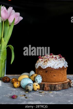 Easter composition with sweet bread, kulich and eggs on light background. Easter holidays breakfast concept. Stock Photo