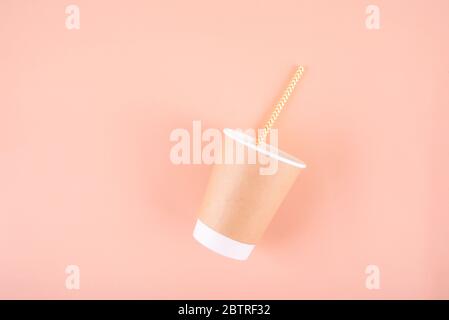 Paper glass with drinking tubes. Eco utensils on a light background. Zero waste.Sustainable lifestyle concept Stock Photo