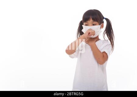 asia women wearing mask to prevent the virus PM2.5, Coronavirus, (2019-nCoV) asian little girl feeling unwell and coughing as symptom for cold or pneu Stock Photo