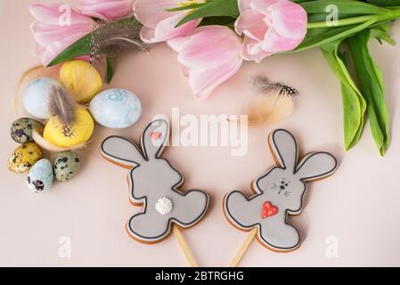 Easter gingerbread on sticks in the form of rabbit, gift, eggs, flowers, festive content. Stock Photo