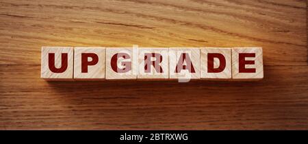 upgrade text on wooden cubes. technological concept Stock Photo