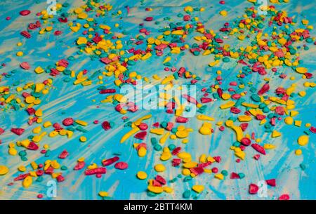 colored shavings on a blue background Stock Photo