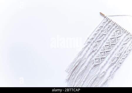 handmade macrame on white background, place for text,, copy space, banner, flat layout, top view, hobby creativity Stock Photo