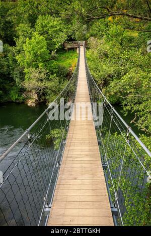 Suspension bridge over the Paiva river, on the Paiva Walkways, near Arouca in Portugal. Stock Photo