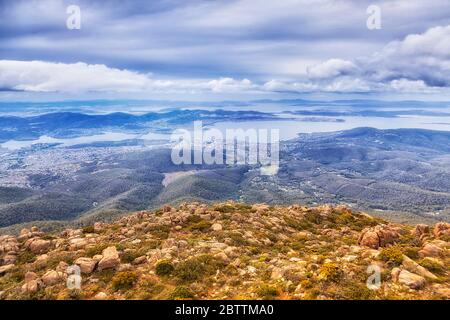 Elevated view from Mt Wellington over Hobart city on a cloudy day. Stock Photo