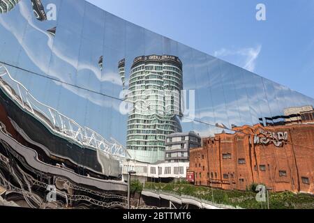 Rotunda and Odeon buildings reflected in mirrored facade of Grand Central shopping centre, New Street, Birmingham. Stock Photo