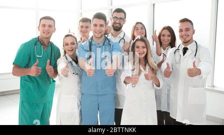 diverse medical professionals giving a thumbs up Stock Photo