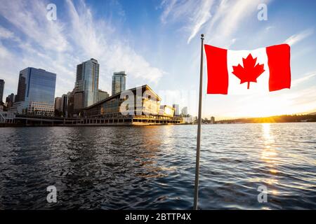 National Canadian Flag with Modern Downtown City in Background Stock Photo