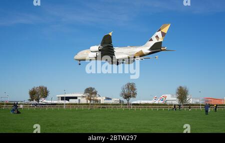 Etihad Airways Airbus A380 landing at Heathrow Airport on a sunny day. London Stock Photo