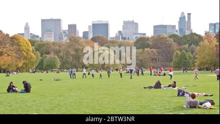 People relaxing in Central Park, Manhattan, New York, USA Stock Photo