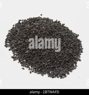 Close-up view of raw black cumin on white background.
