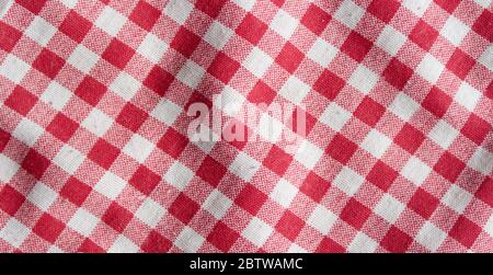Real linen picnic tablecloth. Red and white checkered high detailed background. Stock Photo