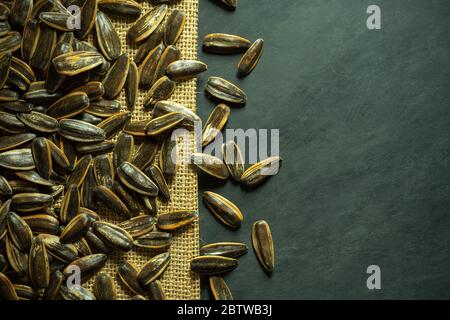 Sun flower seeds on small sack. Top view and copy space for text. Concept of agriculture and organic farm. Stock Photo