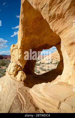 NV00131-00...NEVADA - A window through sandstone buttress viewed along the White Domes Loop Trail in Valley of Fire State Park. Stock Photo