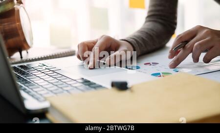 Business woman working in finance and accounting Analyze financial budget at home , Stock Photo