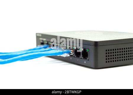 The blue network cables connect port switch on white table concept internet network connection Stock Photo