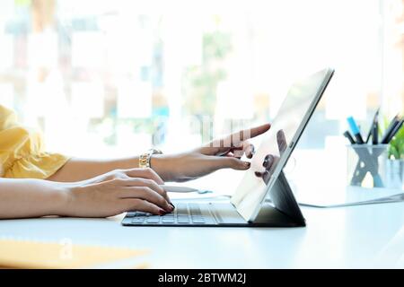 Woman using laptop computer for business financial Stock Photo