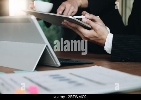Business Finance, accounting, advisor investment consulting marketing plan for the company with using tablet and computer in analysis Stock Photo