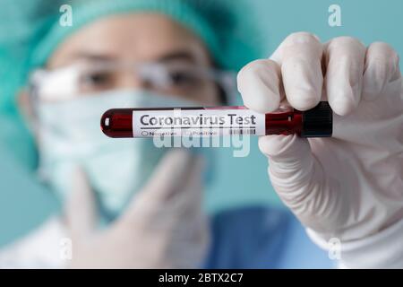 Nurse holding testing patients blood samples for Coronavirus Outbreak (COVID-19) in the laboratory, New coronavirus 2019-nCoV from Wuhan China concept Stock Photo