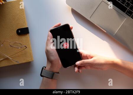 CHIANG MAI, THAILAND - DEC.14 ,2019 : Woman using iPhone Xs with Youtube Music - Stream Songs and Music Stock Photo