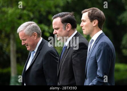 From left to right, Acting Chief of Staff Mark Meadows, Dan Scavino, White House Deputy Chief of Staff for Communications, and Jared Kushner, Presidential advisor and President Trump's son-in-law, depart the White House with President Donald Trump, in Washington, DC on Wednesday, May 27, 2020. President Trump and the First Lady are traveling to NASA's Kennedy Space Center to watch the SpaceX Mission 2 launch. Credit: Kevin Dietsch/Pool via CNP | usage worldwide Stock Photo