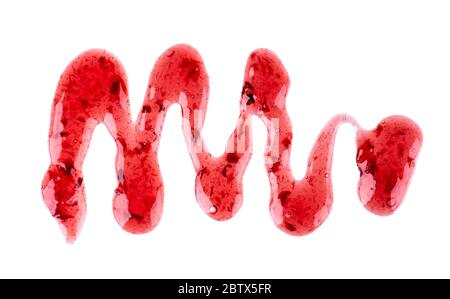 Cherry jam drizzle isolated on white background. Splashes of red berry jam. Top view. Stock Photo