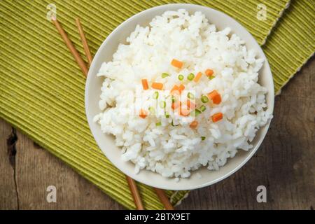 Jasmine rice with chopsticks on a fabric mat Stock Photo