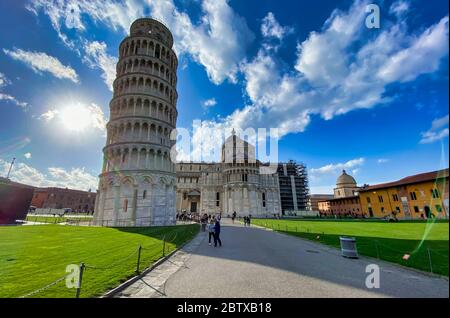 PISA, ITALY - FEBRUARY 25, 2020: Field of Miracles with tourists on a sunny winter afternoon. Stock Photo