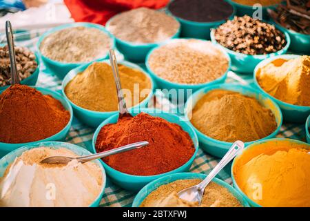 Close View Of Masala Curry, Bright Colors Fragrant Seasoning, Condiment In Tray On Local Food Market, Bazaar. Popular Souvenirs From India. Stock Photo