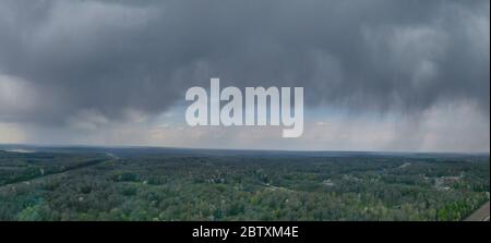 Storm clouds over agricultural fields in the countryside. Stock Photo