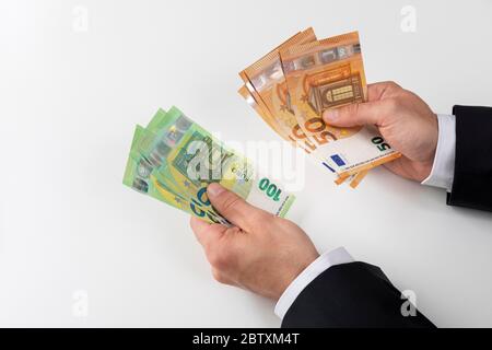 Businessman with 50 and 100 euro banknotes in his hand, Germany Stock Photo