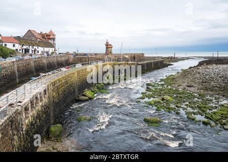 The mouth of the West Lyn River at Lynmouth, north Devon, England, UK.  Rhenish Tower can be seen on the Quay. Stock Photo