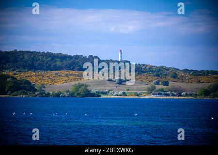 Vitte, Germany. 25th May, 2020. The lighthouse of the Baltic Sea island of Hiddensee can be seen from the Baltic Sea. Credit: Jens Büttner/dpa-Zentralbild/ZB/dpa/Alamy Live News Stock Photo