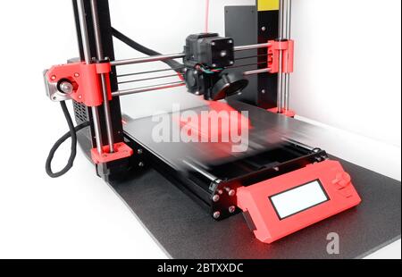 Modern 3D printer printing a plastic object with colored filament. New generation of 3D Printing Machine FFF (Fused Filament Fabrication) or FDM (Fuse Stock Photo
