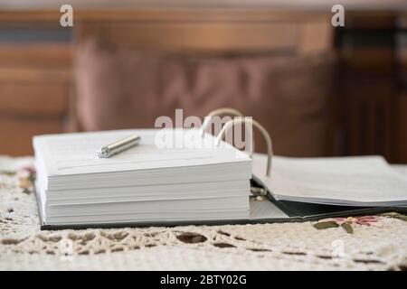 an opened book on a table, indoor with copy space Stock Photo