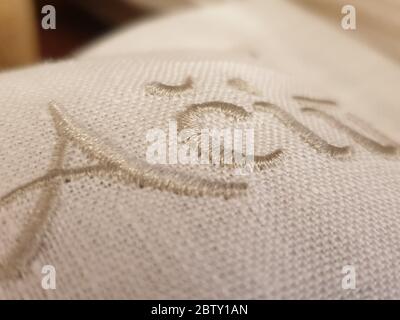 Close up of thank you word knitted on linen fabric Stock Photo