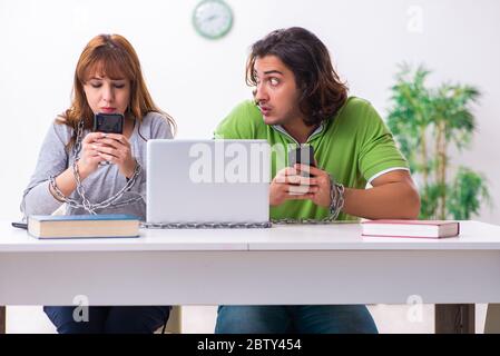Students in gadget dependency concept Stock Photo