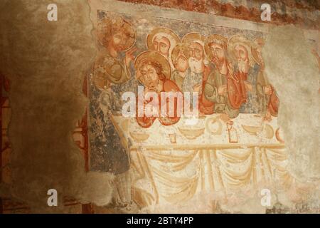 Interior of the Roman-Catholic church in Ghelinta, Romania. 13th century mural depicting the Last Supper. Stock Photo