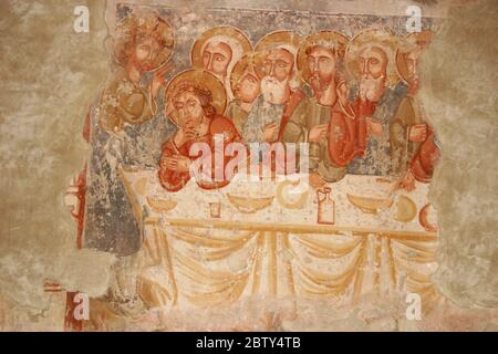 Interior of the Roman-Catholic church in Ghelinta, Romania. 13th century mural depicting the Last Supper. Stock Photo