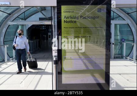 A notice for arriving passengers regarding the Covid-19 Passenger Locator Form at Terminal 2 in Dublin Airport as a requirement for people arriving in Ireland from overseas to alert the authorities where they will be self isolating has come into effect. Stock Photo