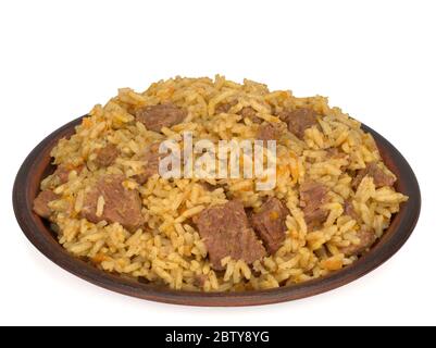 rice pilaf with meat carrot and onion in a plate isolated on white background Stock Photo