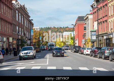 View of the busy State Street lined with old brick buildings in downtown Montpelier, VT, on a sunny autumn morning Stock Photo